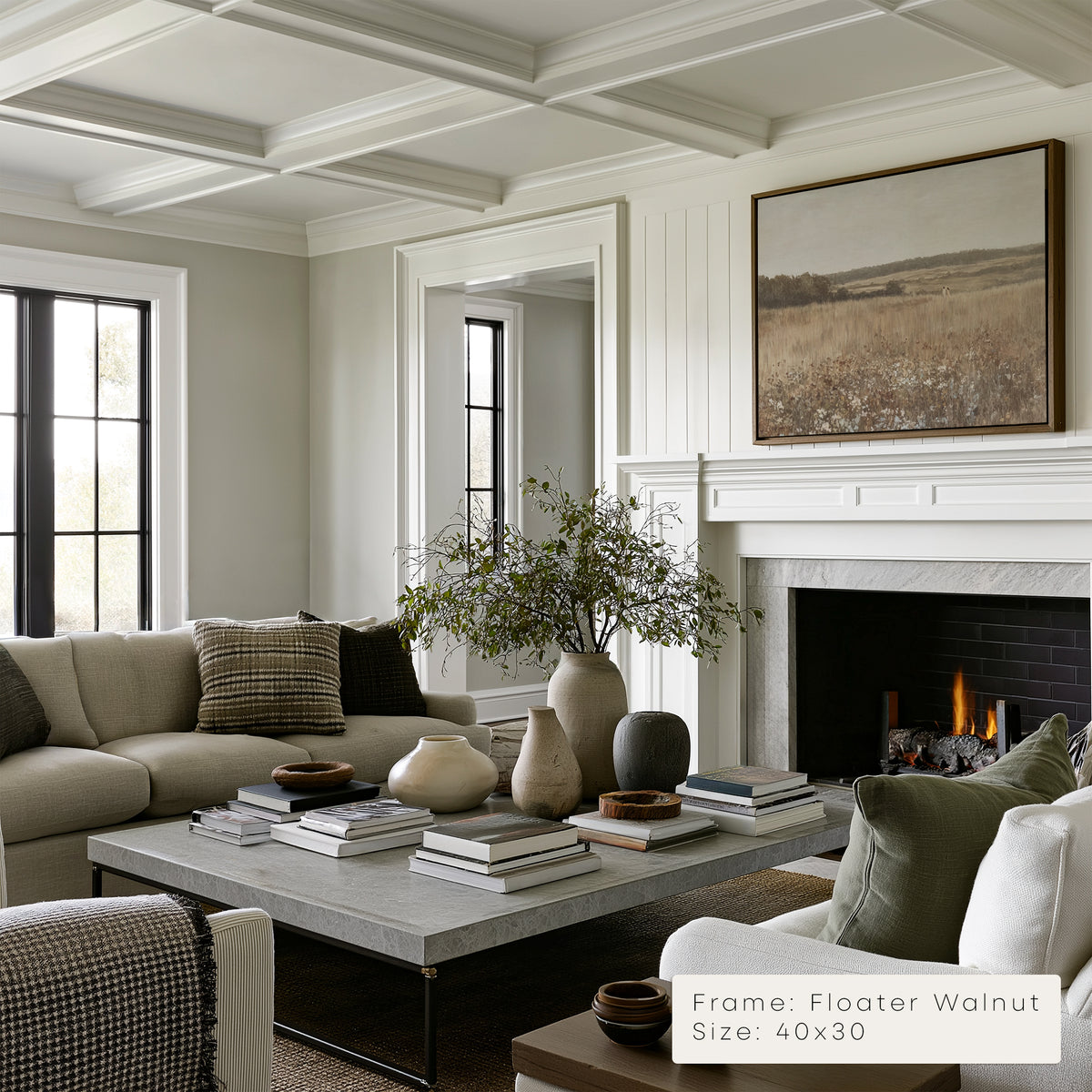 Living room with a fireplace, sofa, coffee table, and decorative items.