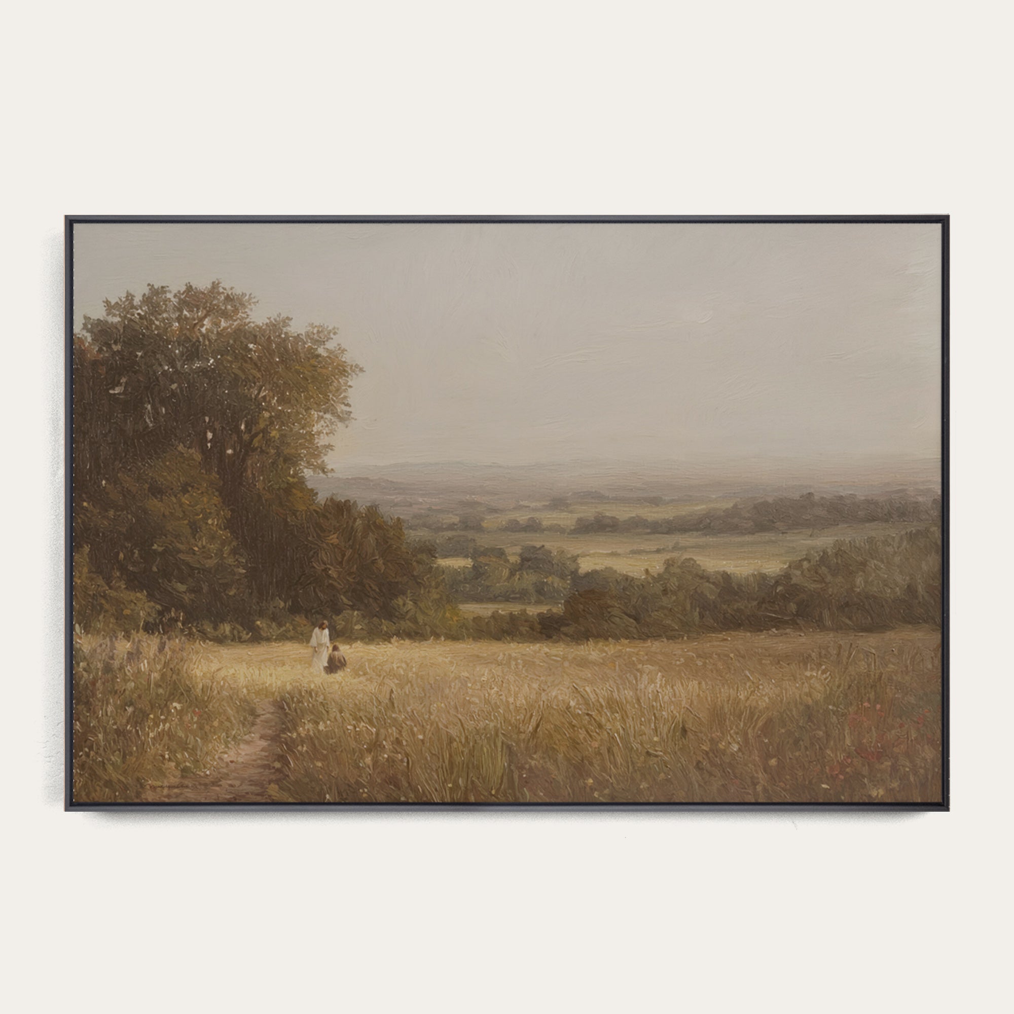 Framed landscape painting of a person walking through a field with trees and a misty background. 