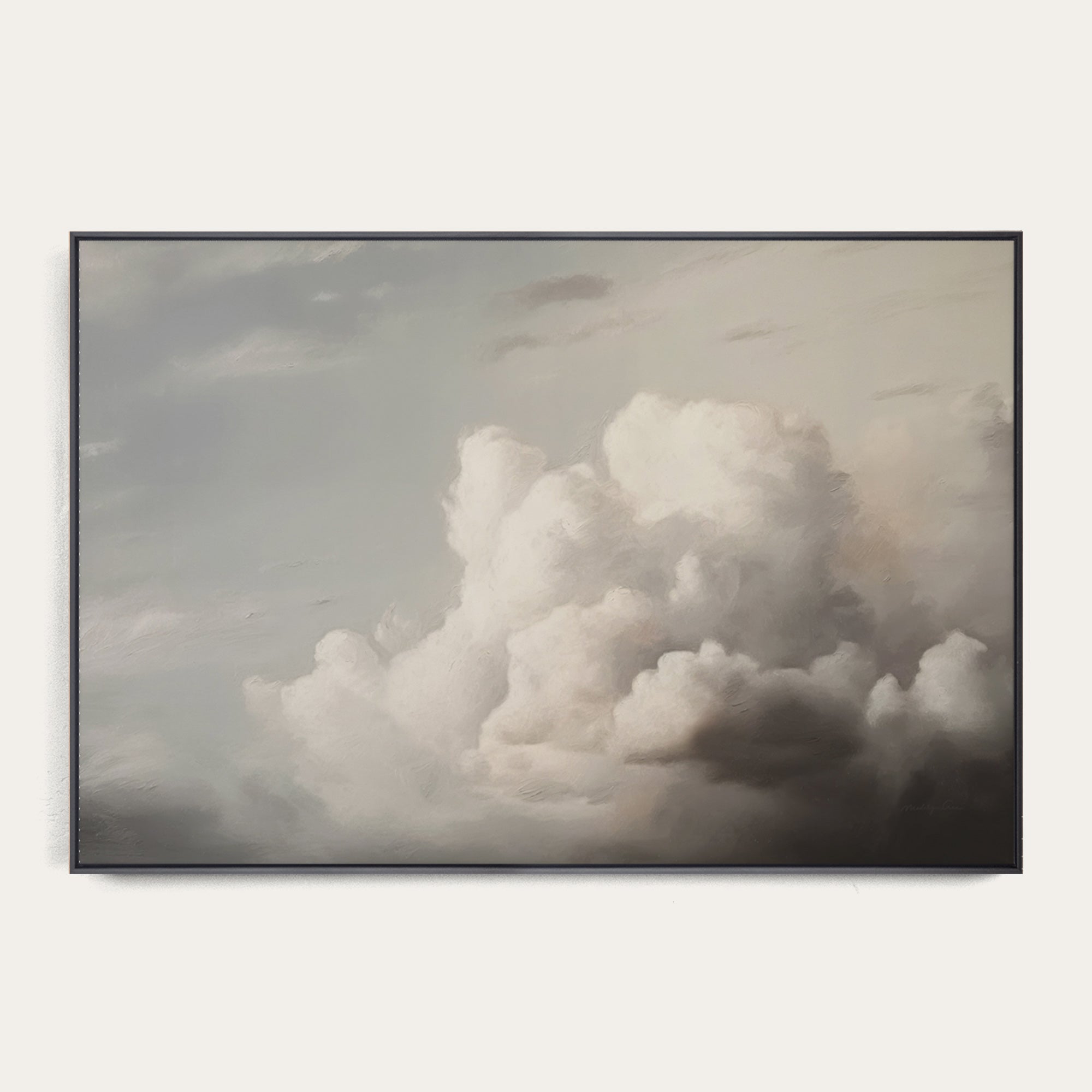 Framed artwork of a dramatic cloud formation on a white wall 