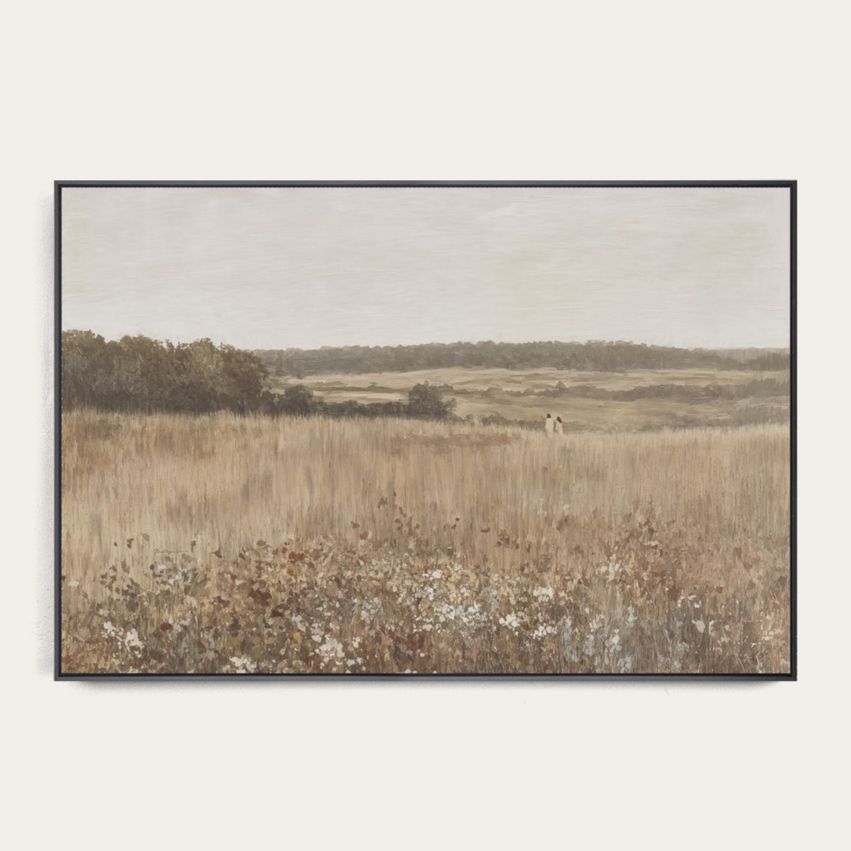 Framed landscape print of a field with trees and sky. 
