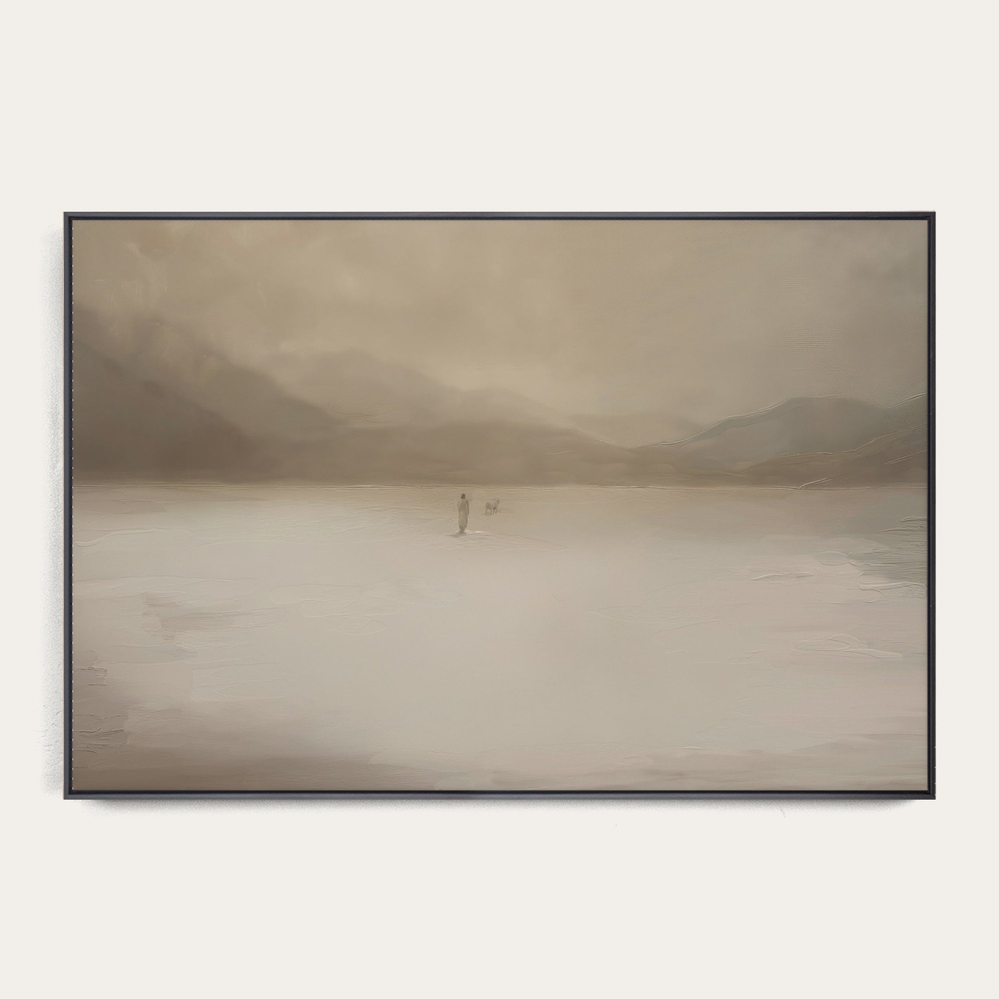Framed artwork of a misty landscape with a person standing on a lake. 