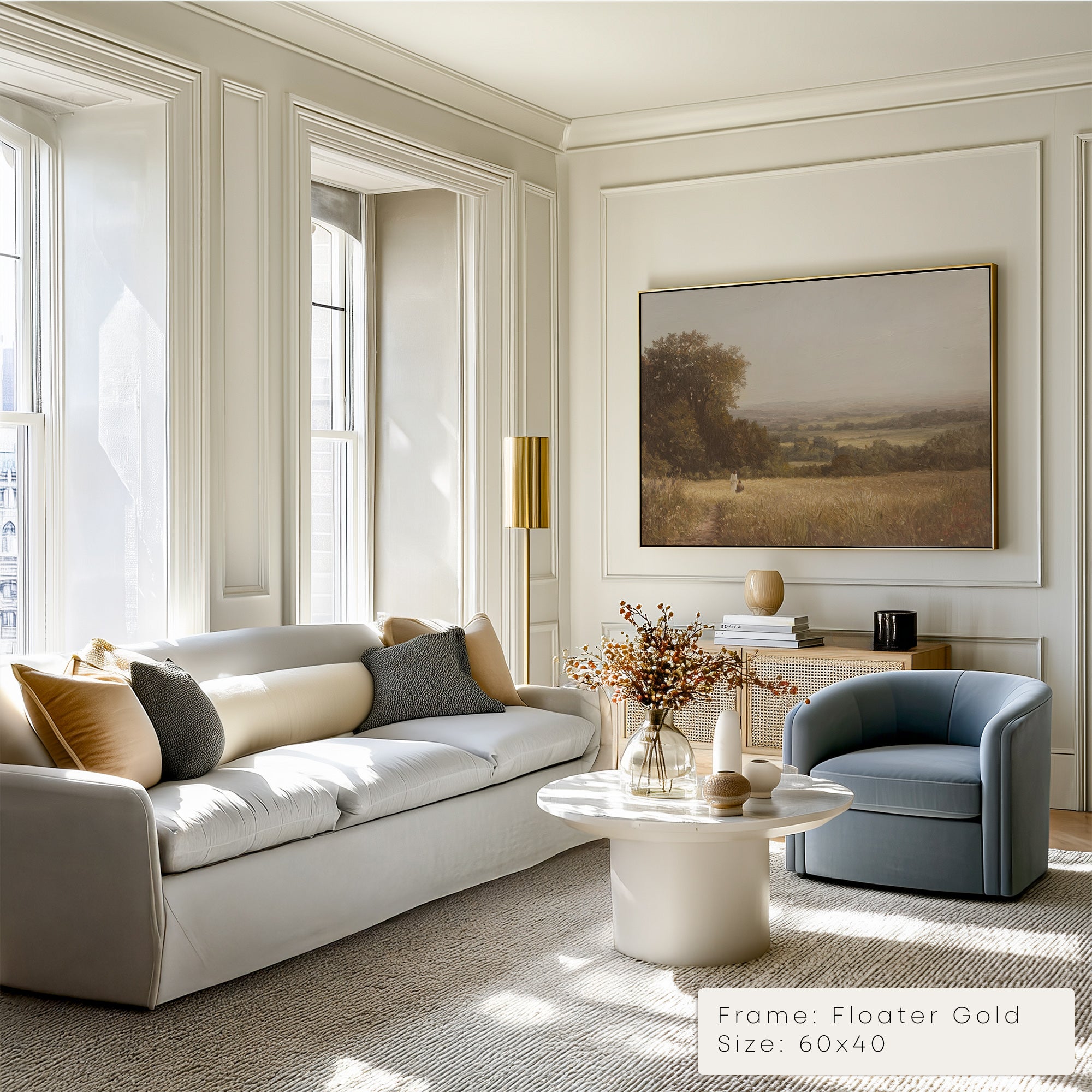 Modern living room with a gray sofa, round coffee table, and wall art.