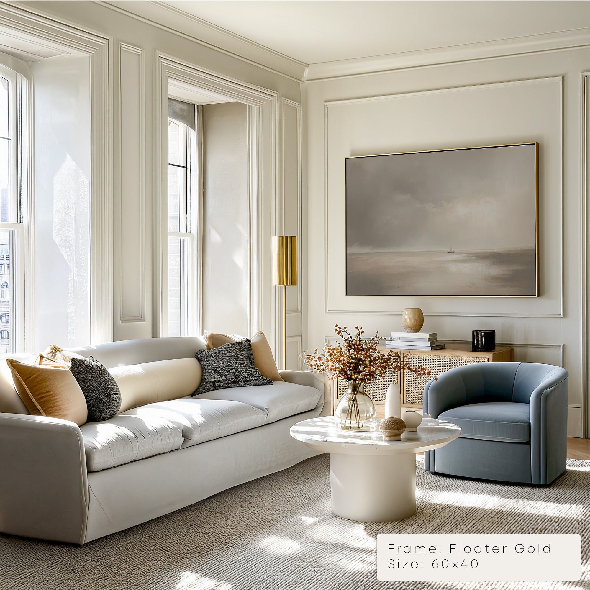 Modern living room with a sofa, armchair, and wall art.