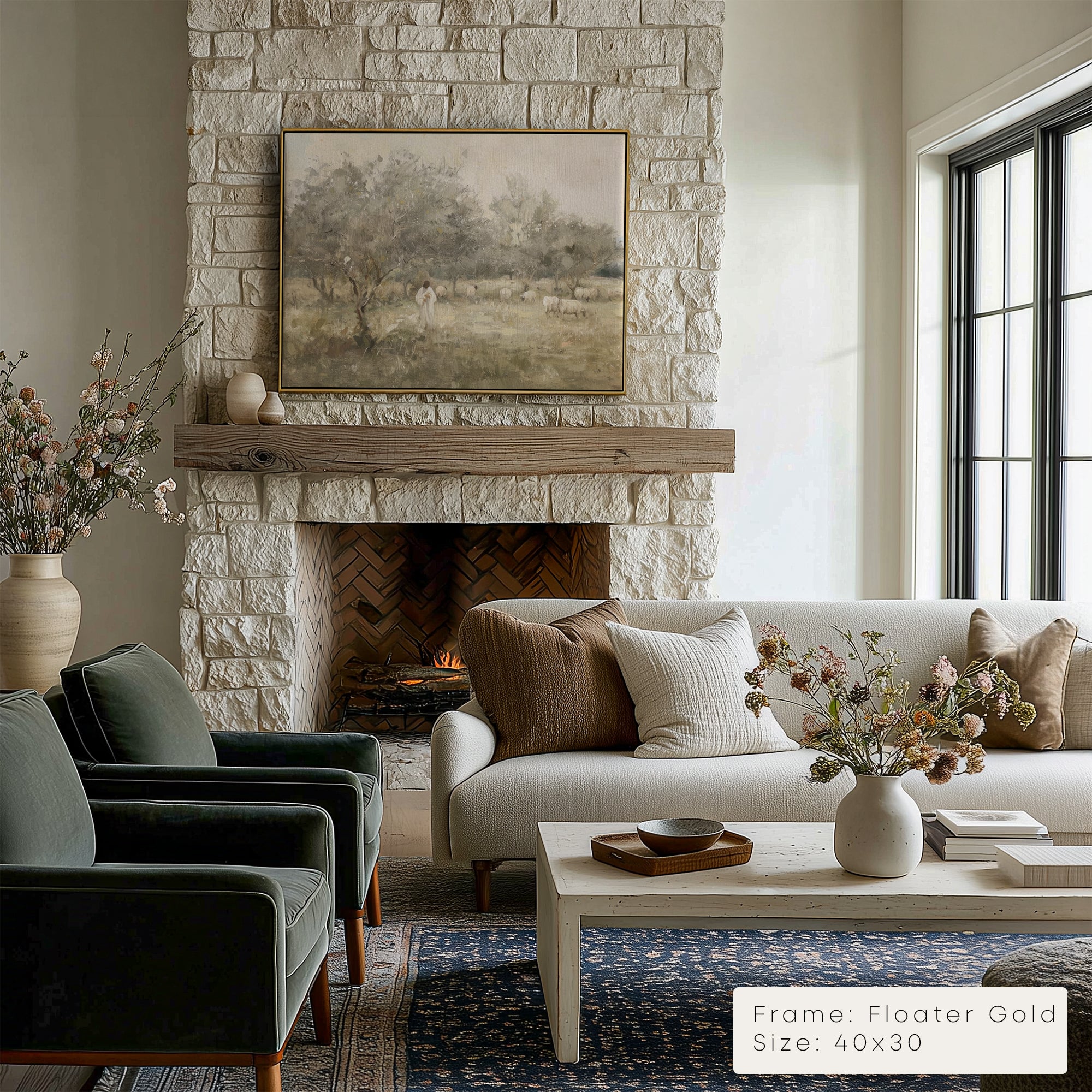 Living room with stone fireplace, gray sofa, and coffee table with decor items.
