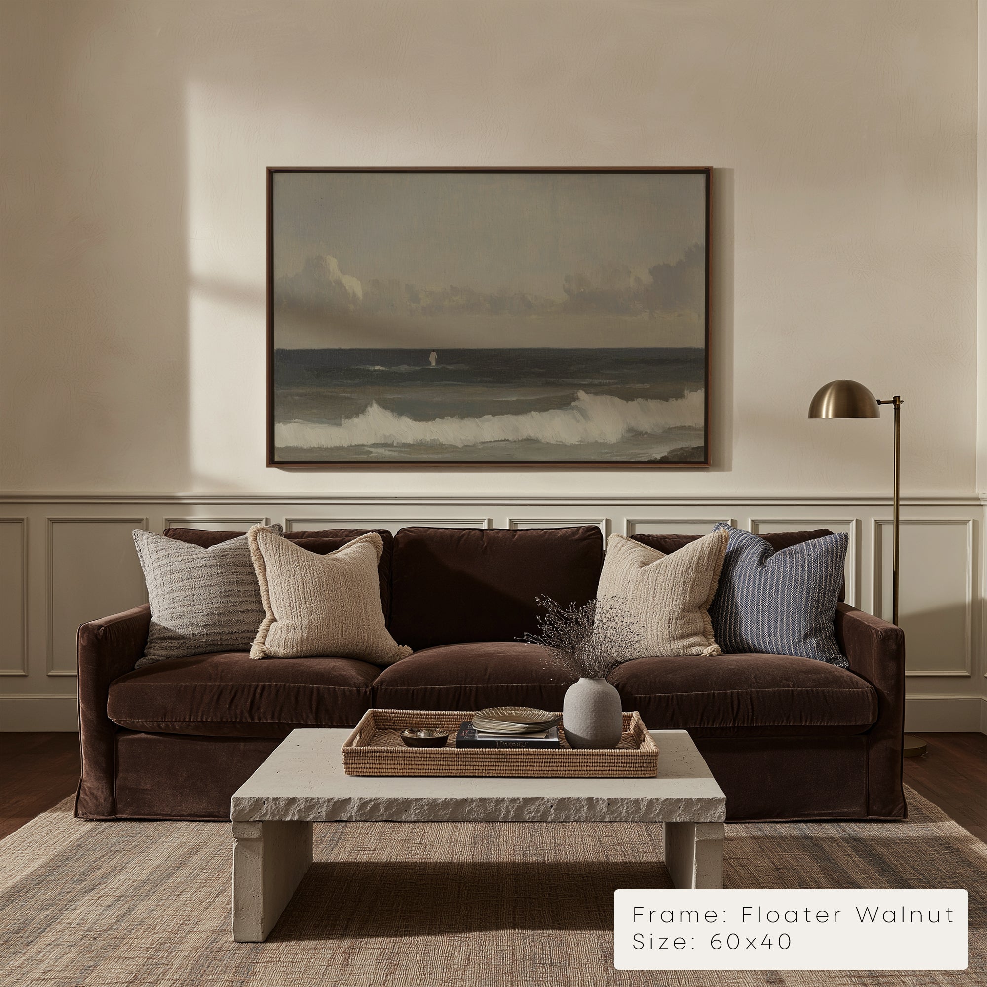 Living room with a brown sofa, marble coffee table, and framed artwork on the wall.
