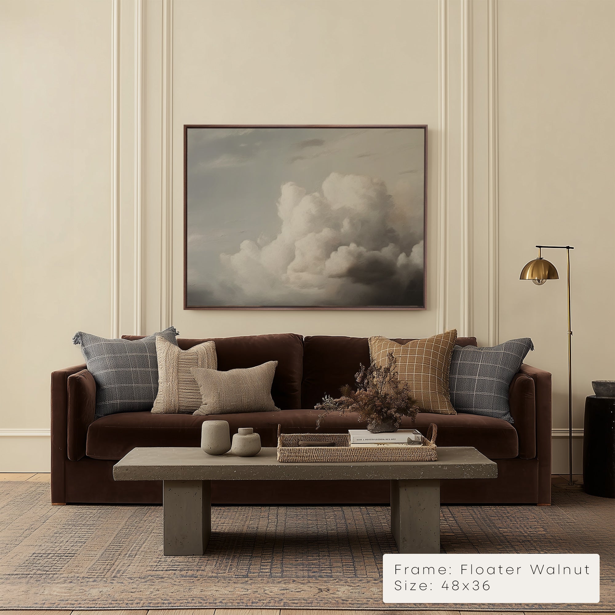 Living room with a brown sofa, coffee table, and wall art