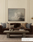living room with a brown sofa, coffee table, and wall art