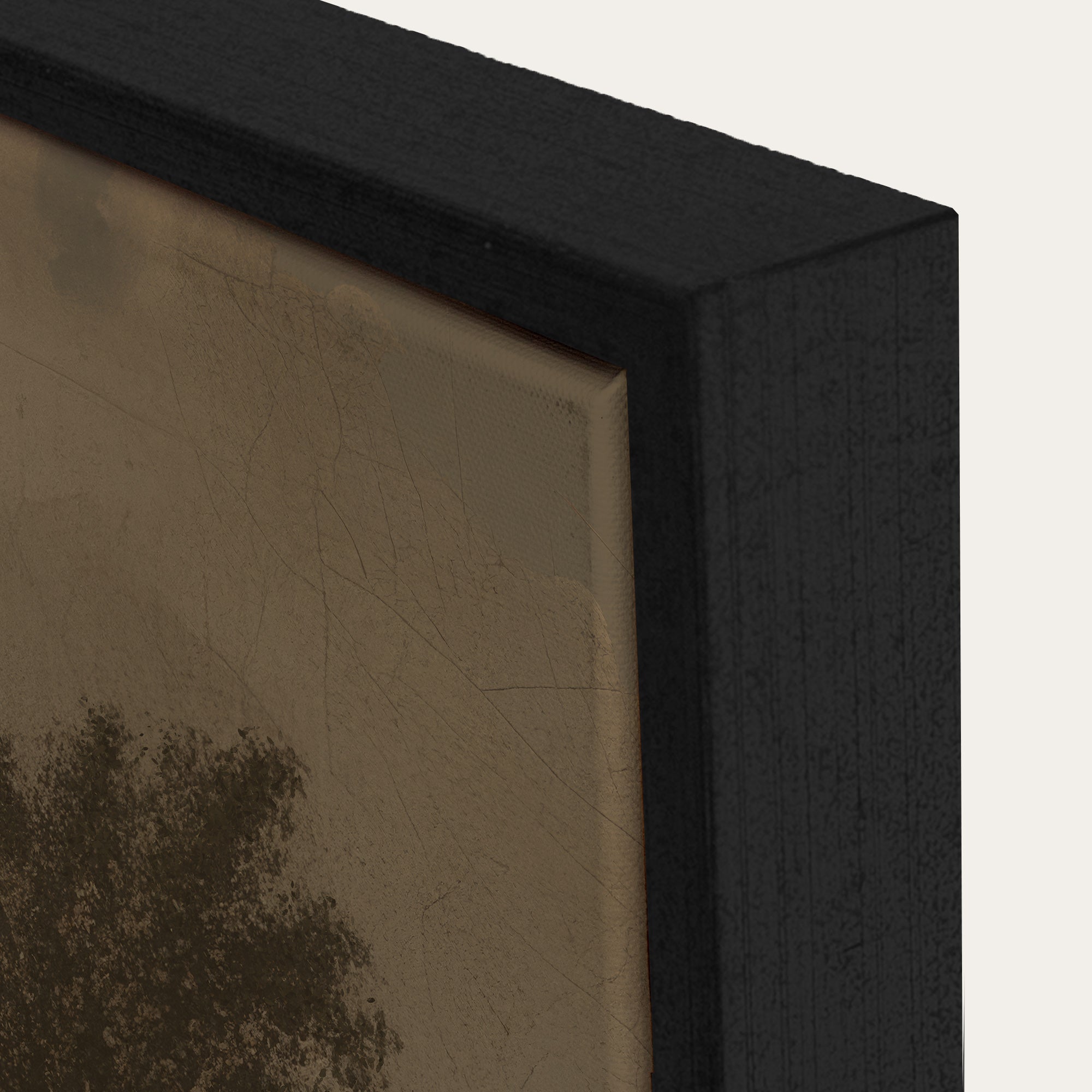 Close-up of a black framed artwork with a textured beige background 