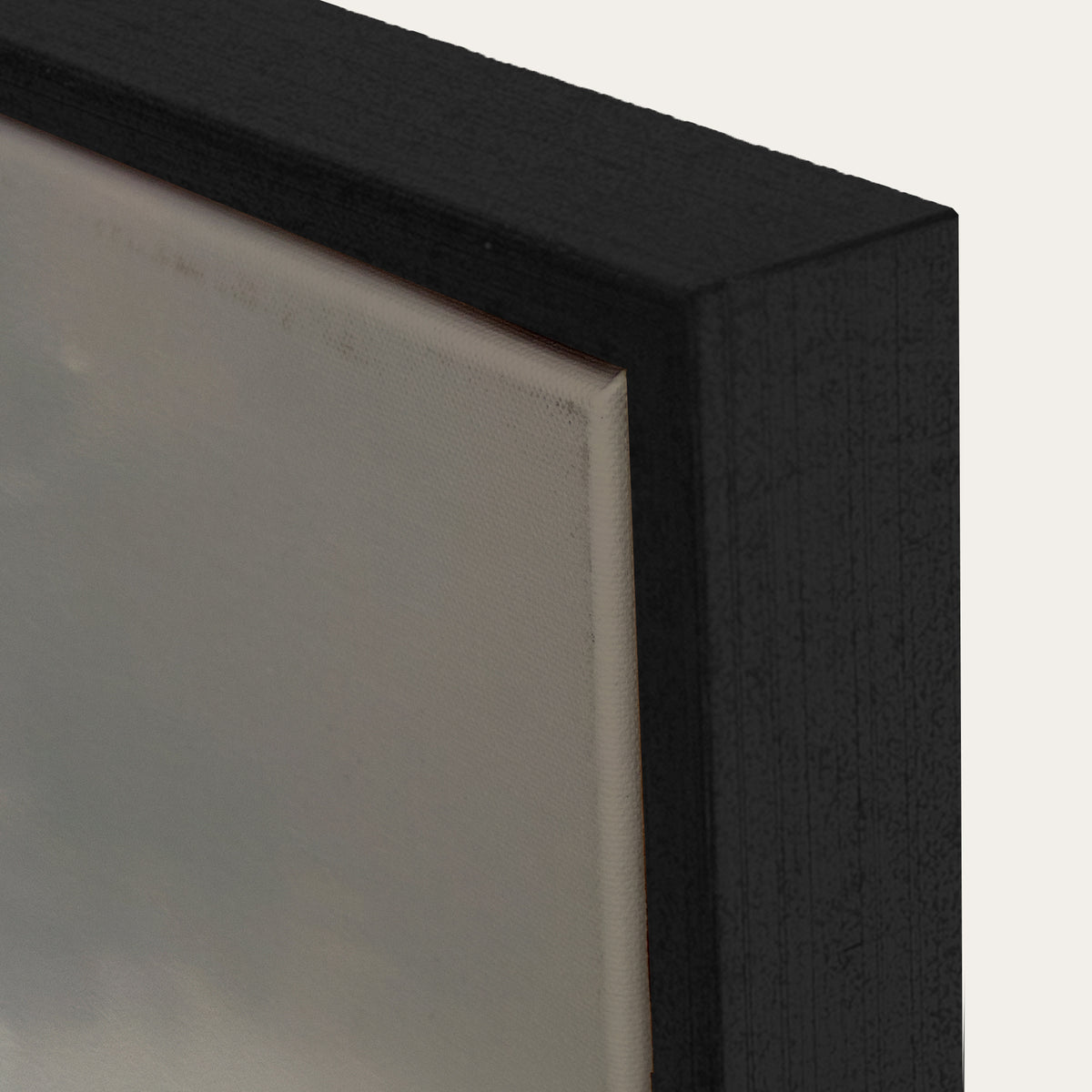 Close-up of a black rectangular object with a reflective surface on a white background 