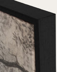close-up of a framed artwork with a black frame and textured gray background. 