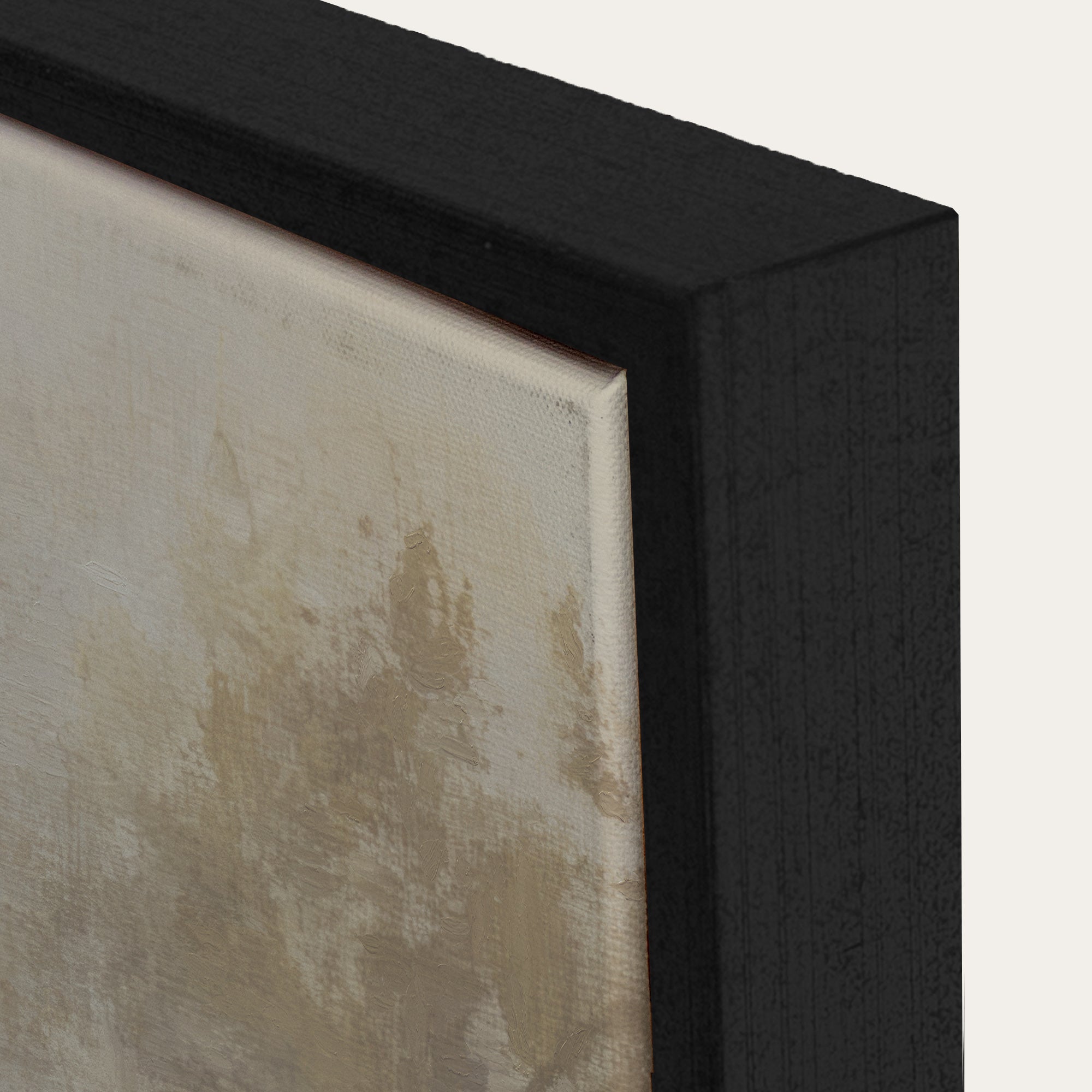 Close-up of a textured wall art piece with a black frame. 