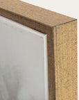 close-up of a wooden frame corner with a neutral background. 