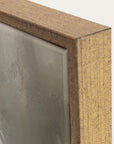 close-up of a wooden frame corner with a textured surface. 
