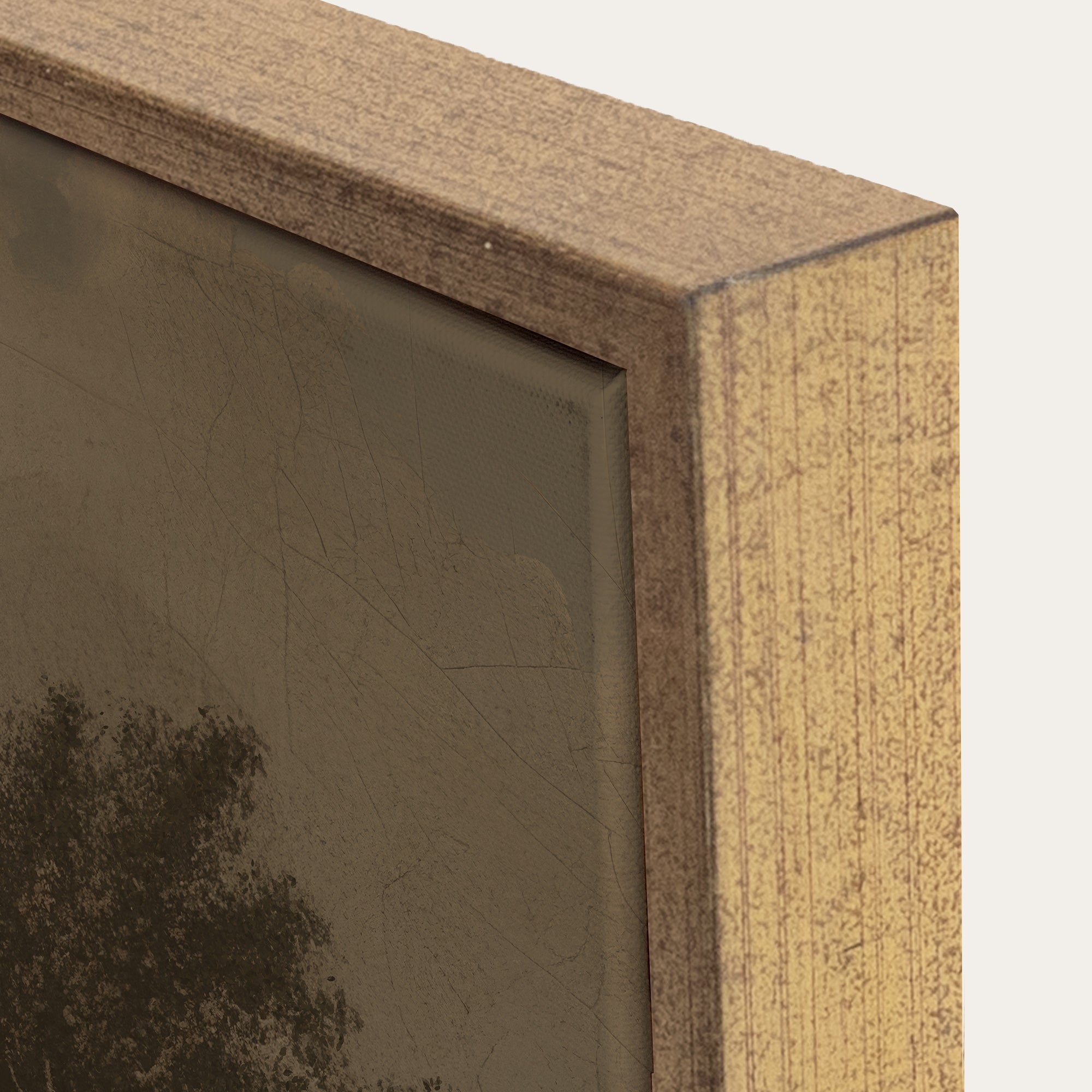 Close-up of a wooden picture frame corner with a blurred artwork inside. 