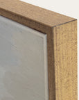 close-up of a wooden frame corner with a neutral background 