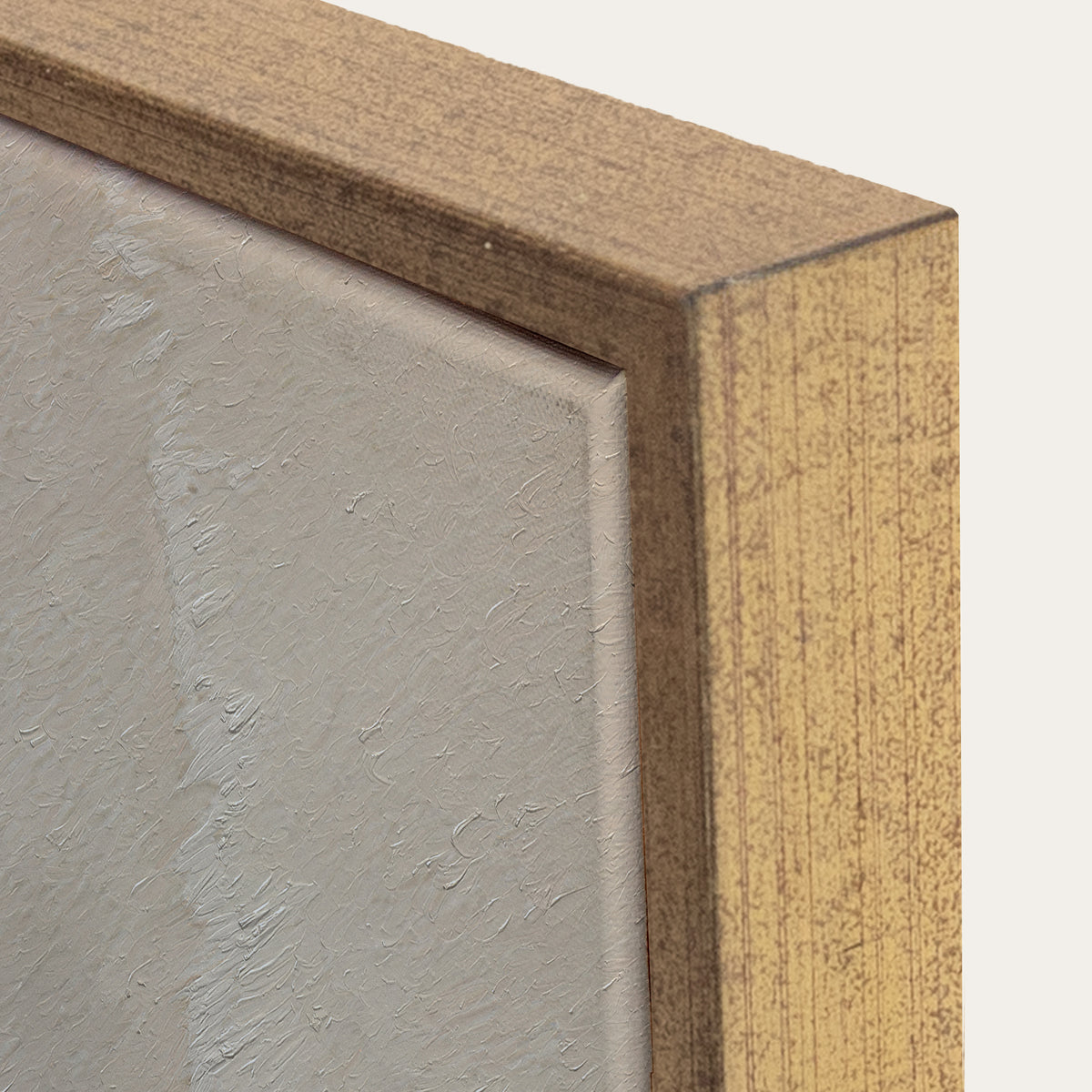 Close-up of a wooden frame corner with a textured gray surface inside 