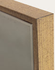 close-up of a wooden frame corner with a neutral background 