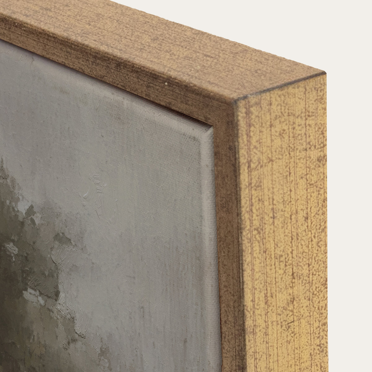 Close-up of a wooden frame corner with a textured gray surface inside 