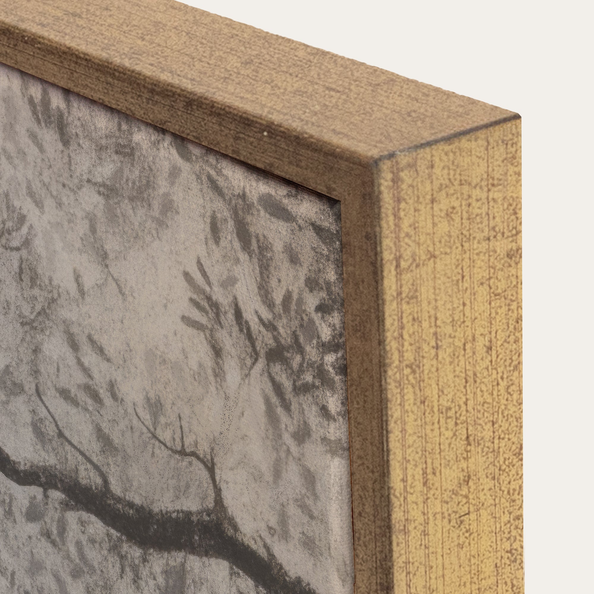 Close-up of a wooden frame with a textured wall background 