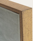 close-up of a wooden frame corner with a glass panel 