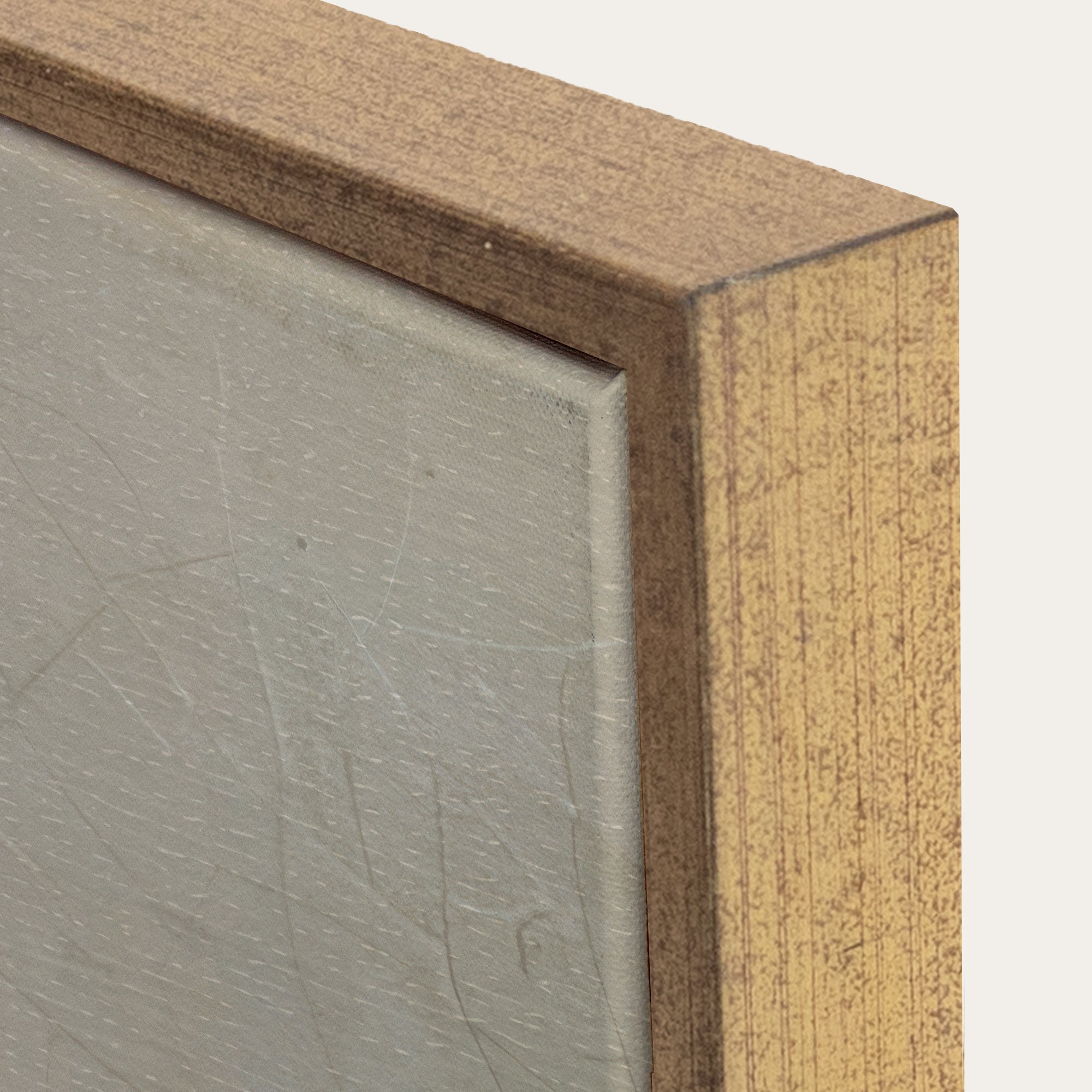 Close-up of a wooden frame corner with a textured gray surface inside 