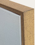 close-up of a wooden frame corner with a glass panel 
