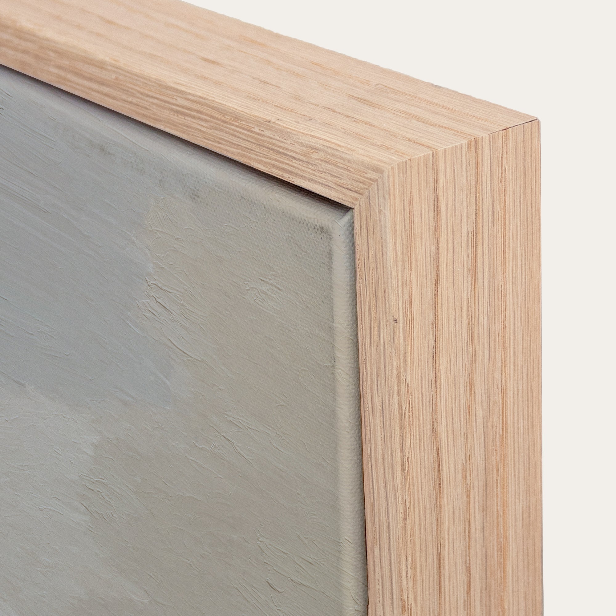 Close-up of a wooden frame corner with a glass panel 