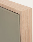 close-up of a wooden frame corner with a green background 