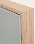 close-up of a wooden frame corner with a gray background 
