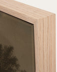 close-up of a wooden picture frame with a blurred background 