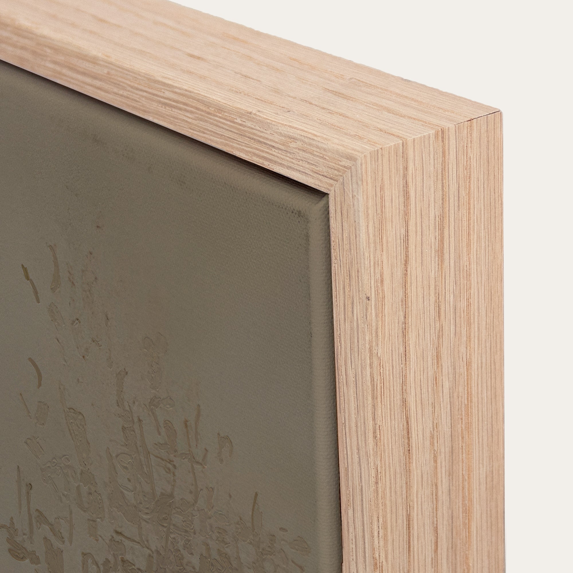 Close-up of a wooden picture frame with a neutral background 