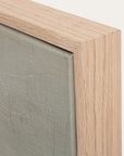 close-up of a wooden frame with a textured green surface inside 