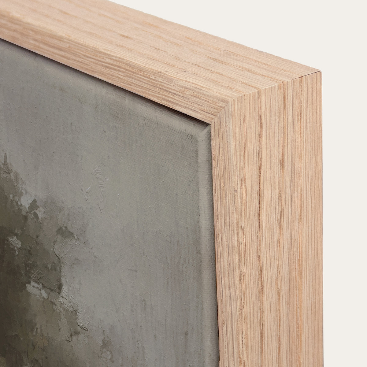 Close-up of a wooden picture frame with a textured gray background 