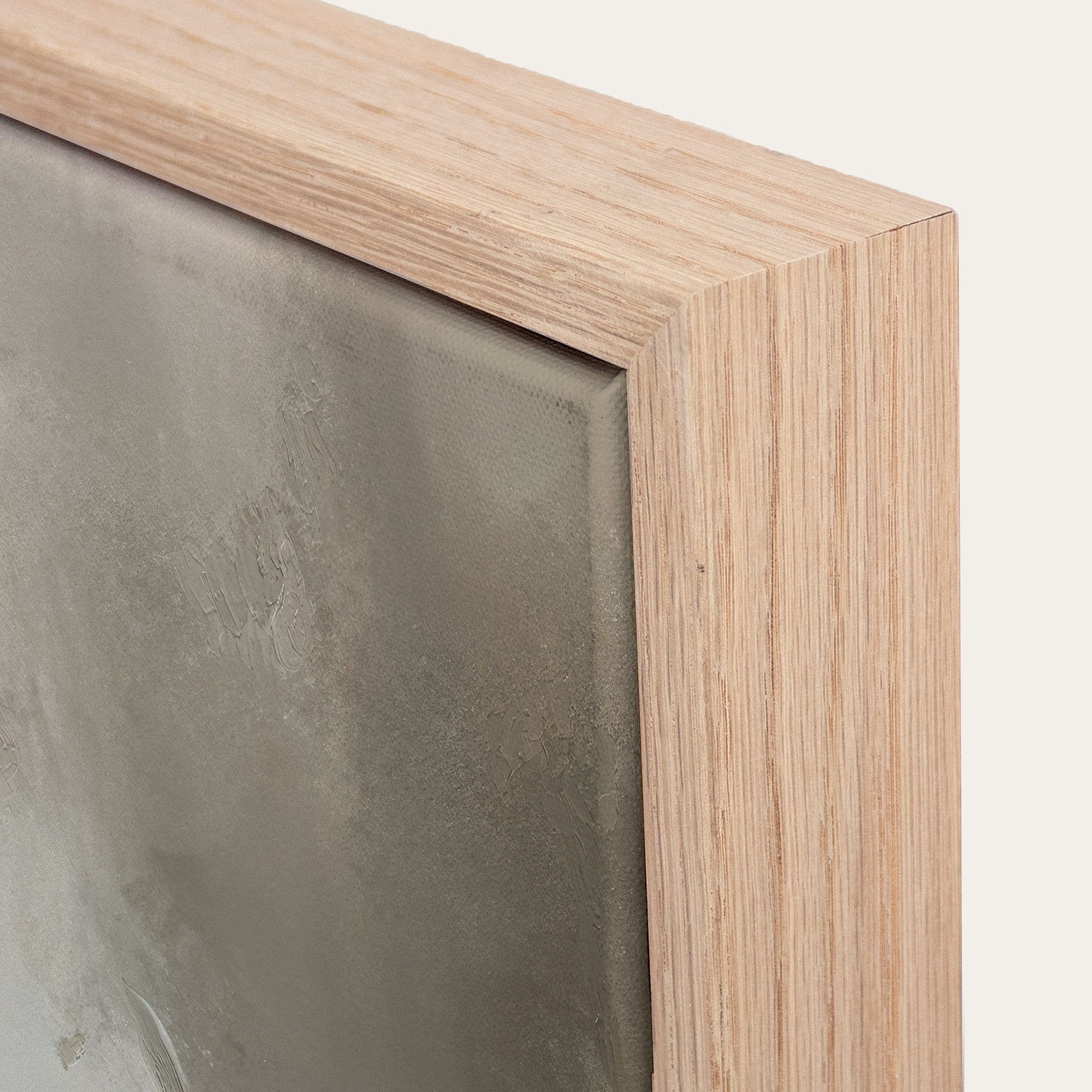 Close-up of a wooden frame corner with a textured surface. 