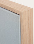 close-up of a wooden frame corner with a textured gray surface. 