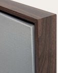 close-up of a wooden frame corner with a neutral background 