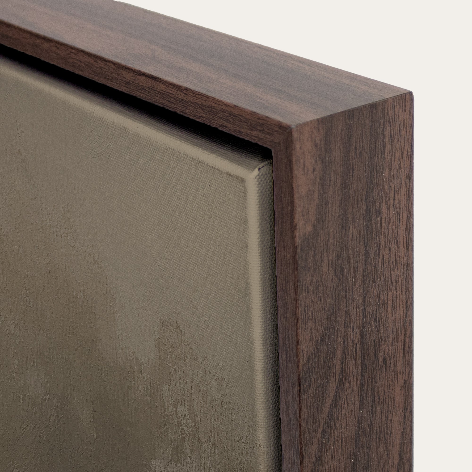 Close-up of a wooden frame corner with a neutral background 