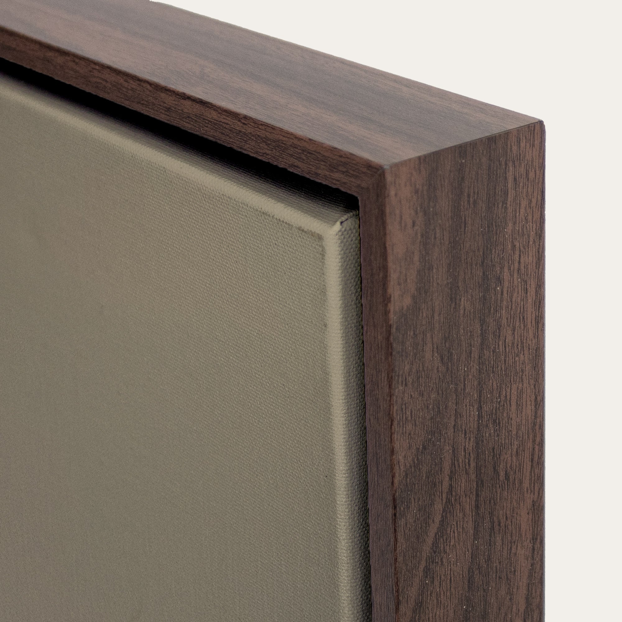 Close-up of a wooden frame corner on a neutral background 