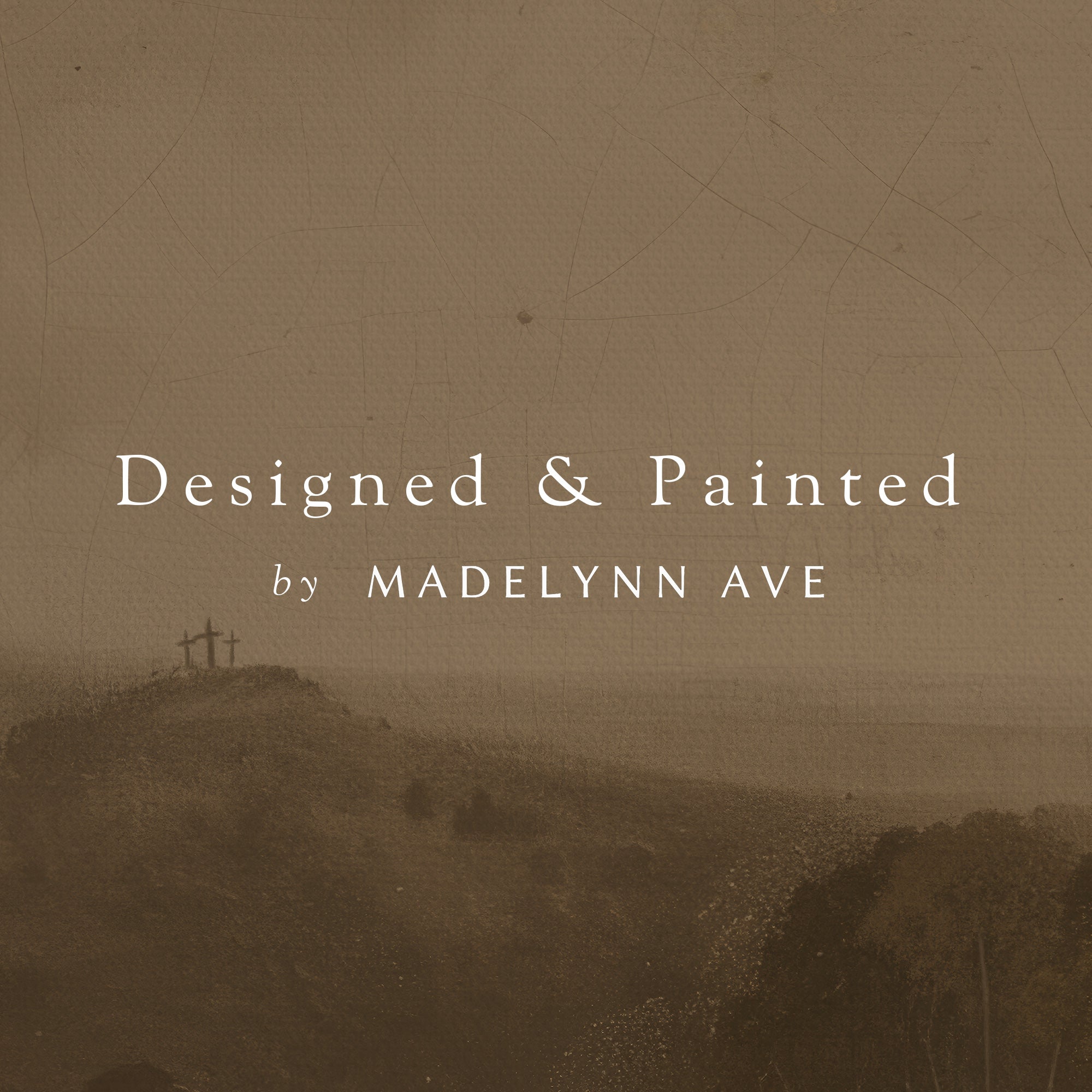 Hilly landscape with crosses on a brown textured background, featuring text 'Designed &amp; Painted by Madelynn Ave'.