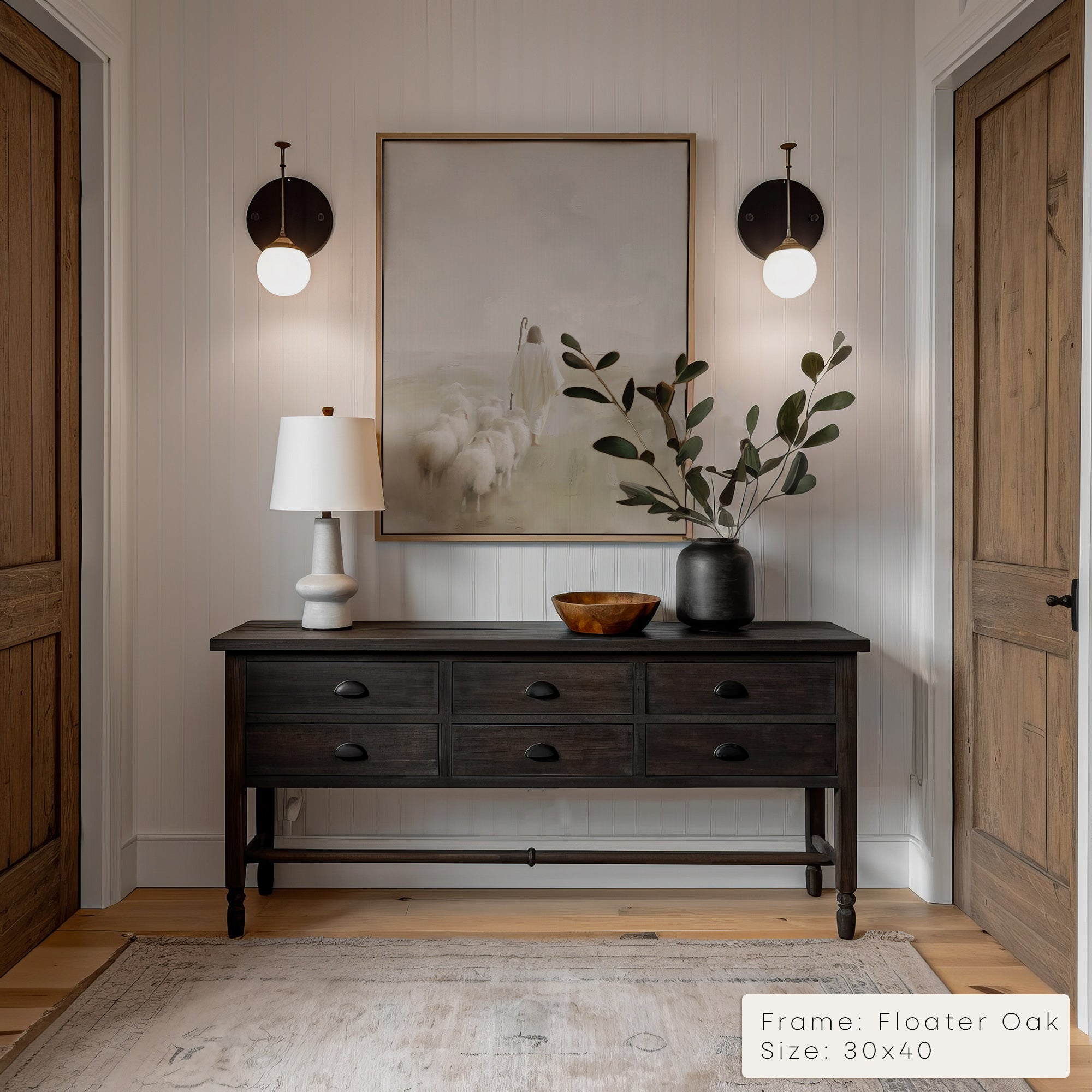 Foyer with wooden console table, lamp, and artwork on a neutral wall.
