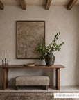 A floating walnut console table in a rustic entryway setting, styled with a matching upholstered bench, a large ceramic vase with greenery, a framed landscape print on the wall, and a rug on the floor. Text overlay at the bottom right reads 'FLOATER WALNUT | 40 x 30'.