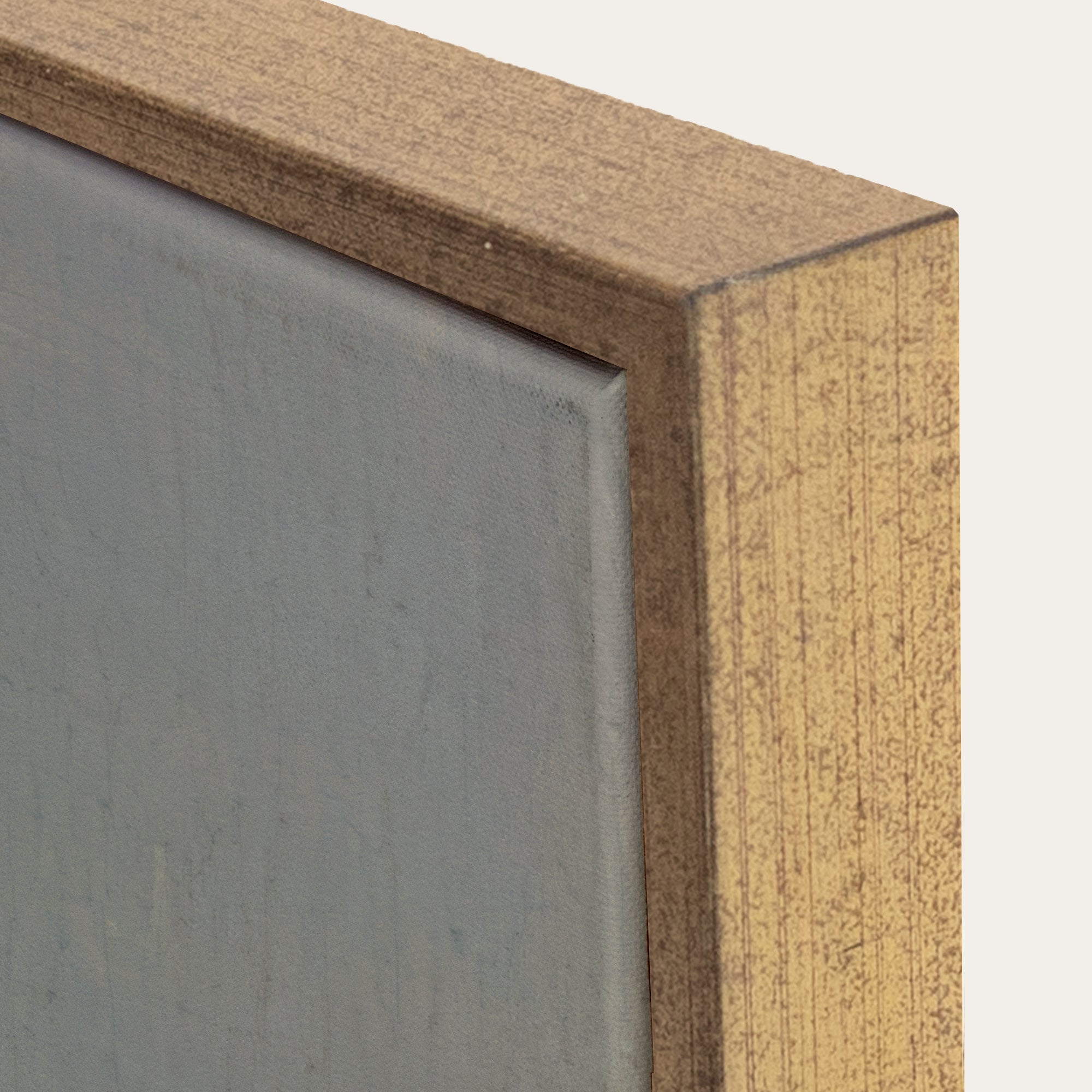 Close-up of a wooden frame corner with a gray background 