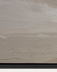 textured beige surface with a signature at the bottom 
