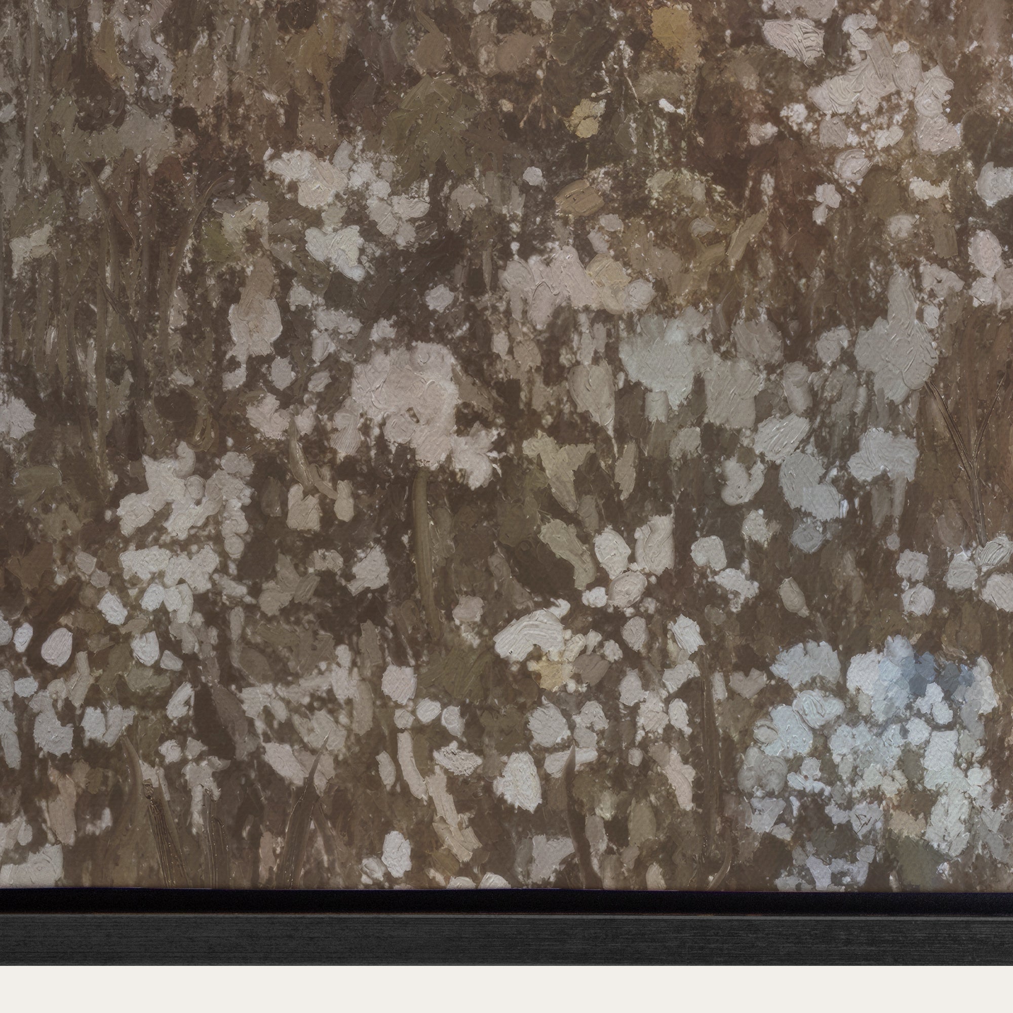 Close-up of a textured brown and beige fabric with a black border 