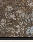 close-up of a textured brown and beige fabric with a black border 