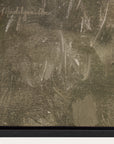 close-up of a textured surface with a signature in the top left corner. 