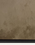 textured brown wall with a signature at the bottom right corner 