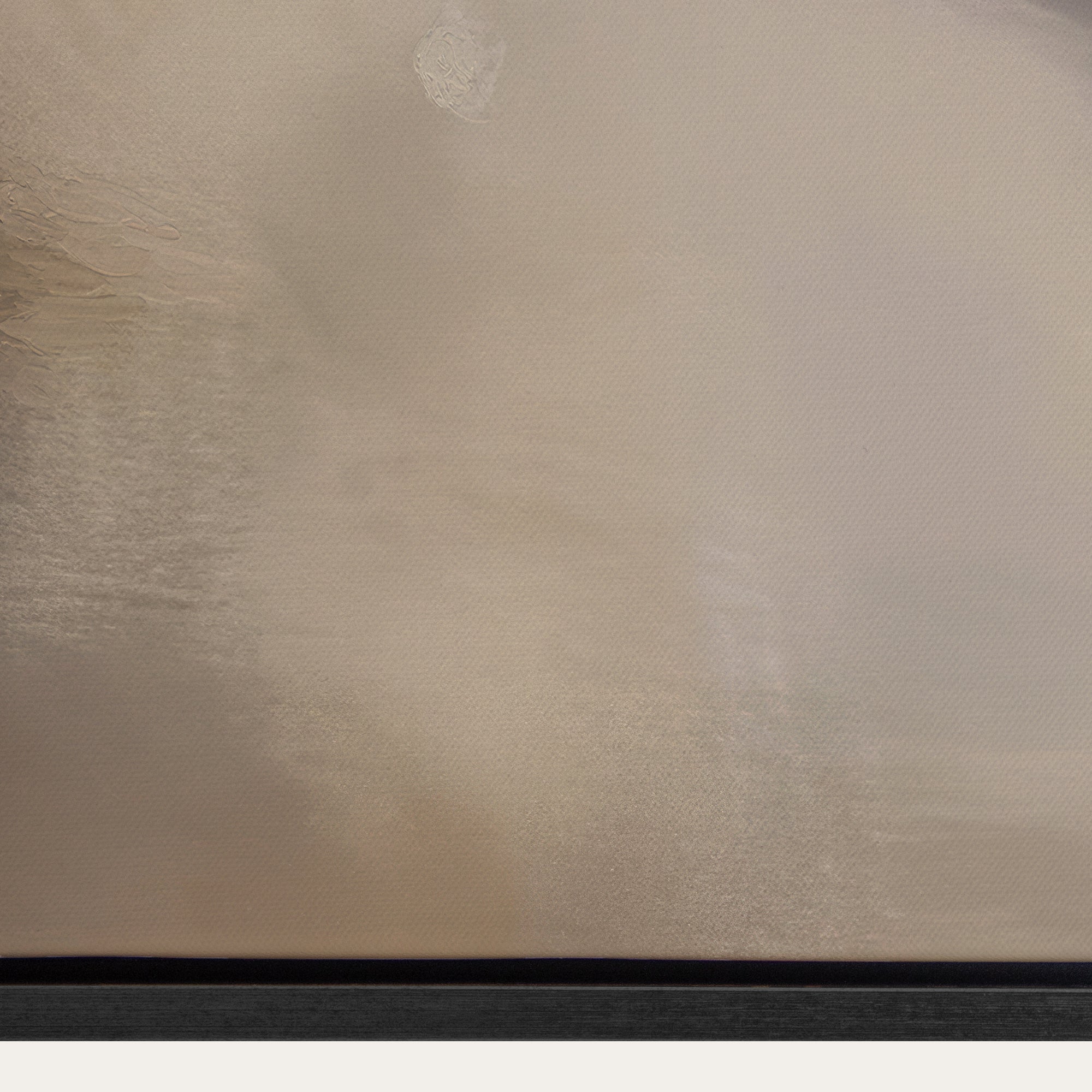 Textured beige surface with a black border 