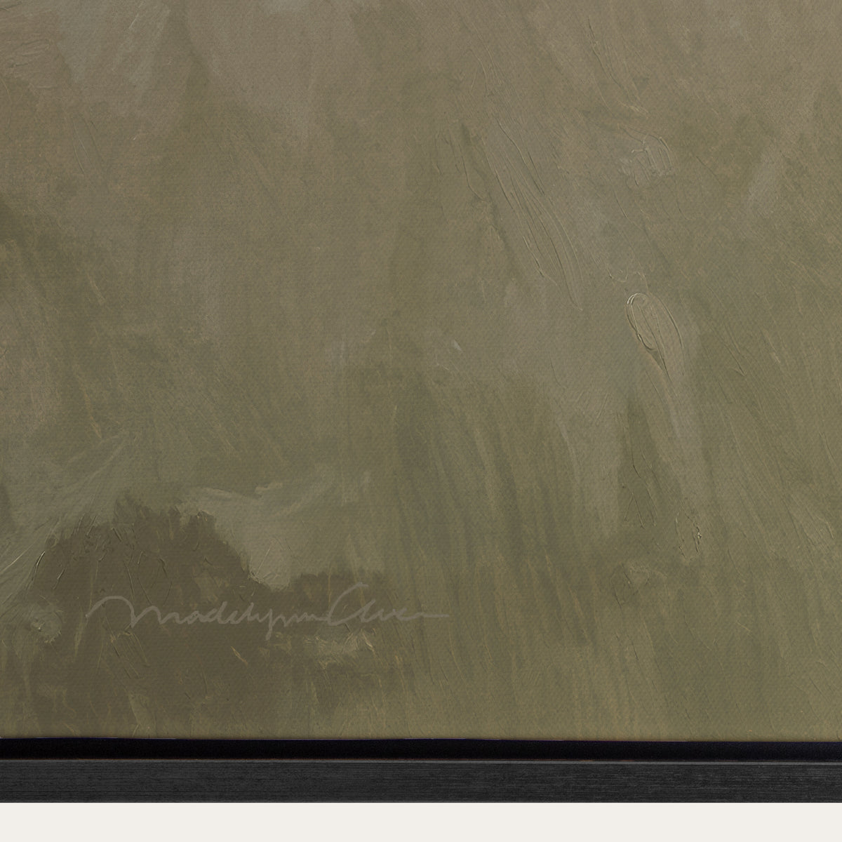 Textured green surface with a signature at the bottom right corner 