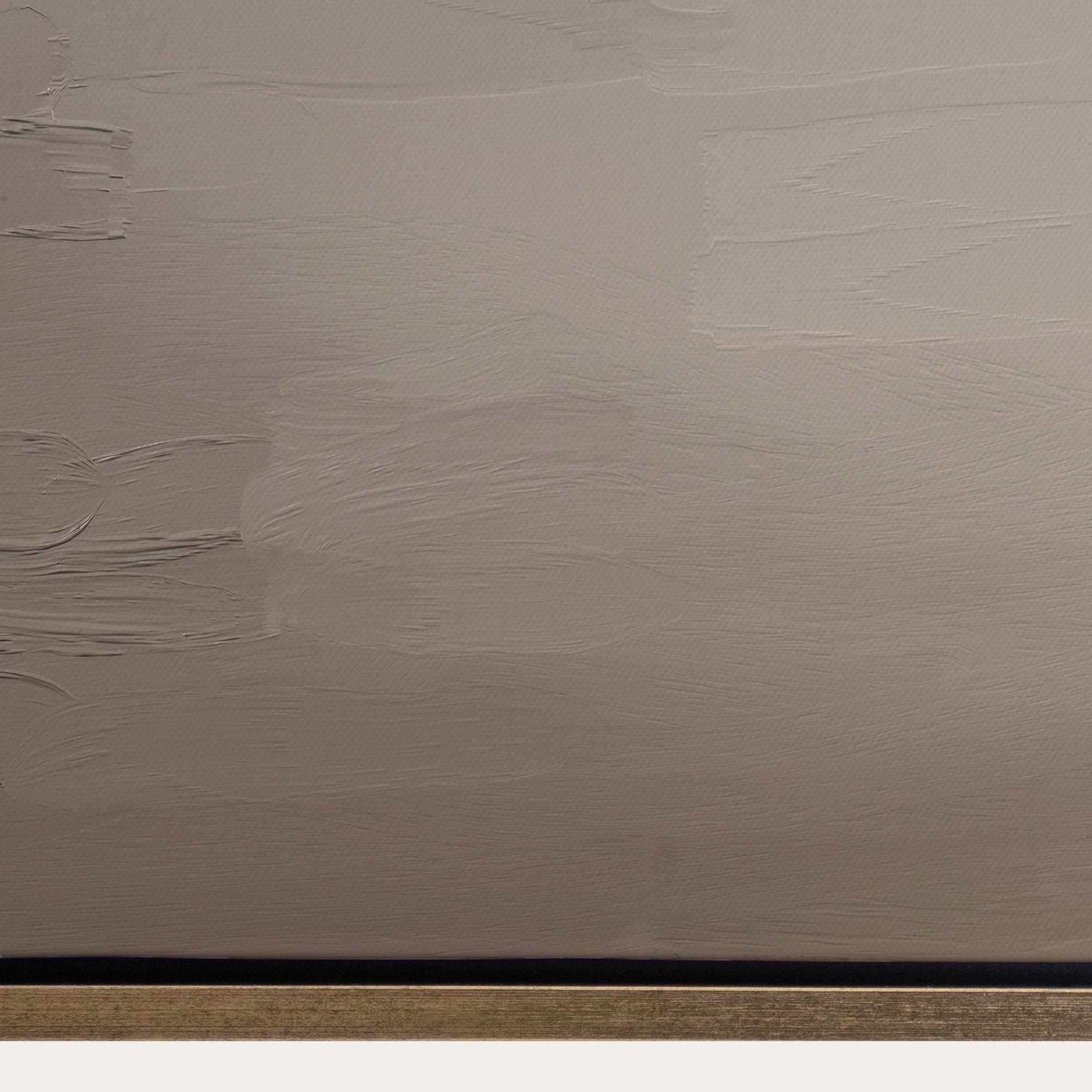 Textured beige wall with a black strip at the bottom 